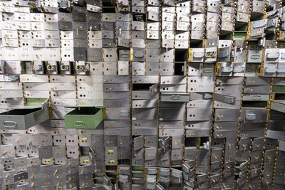A bunch of open and ransacked safe deposit boxes