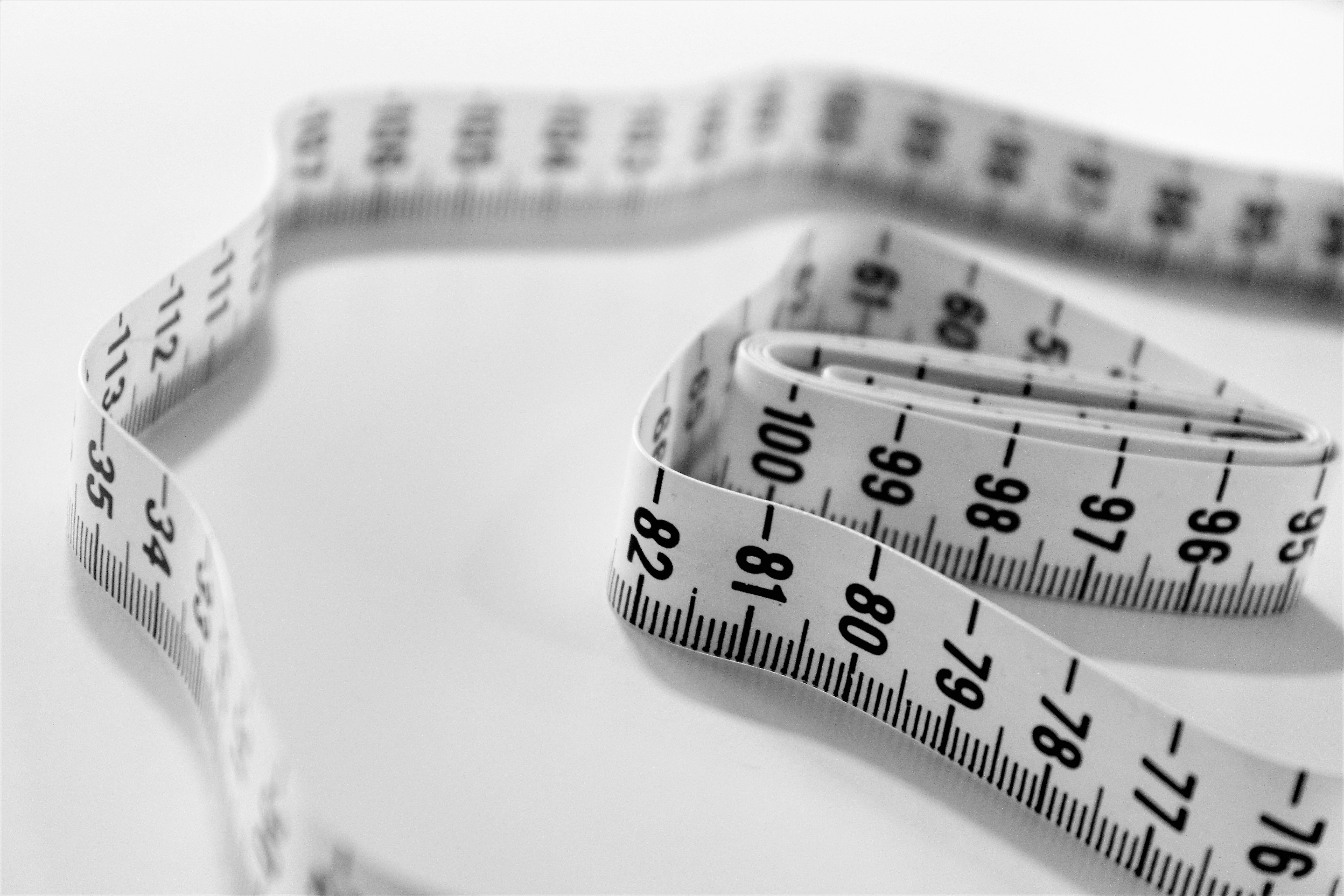 Selective focus photography of a tape measure typically used for clothing
